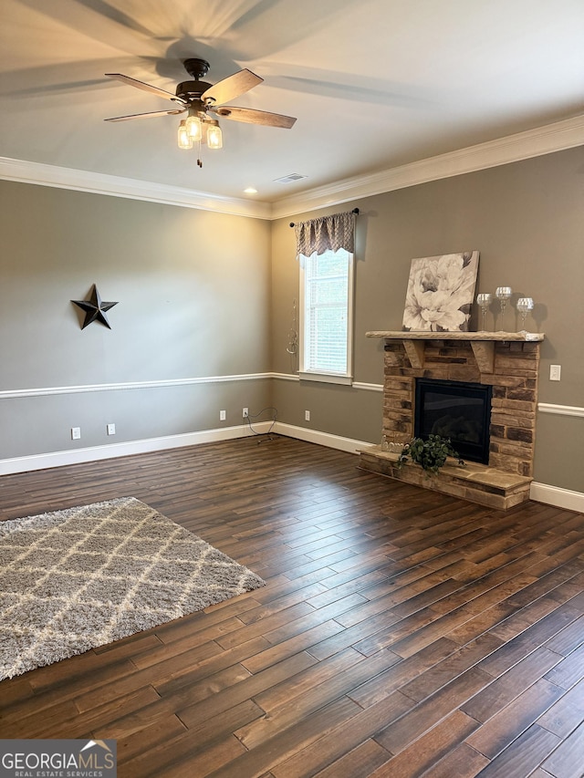 1869 Schofield Dr, Hampton, GA 30228 - unfurnished living room featuring ornamental molding, a ceiling fan, a fireplace, and wood finished floors