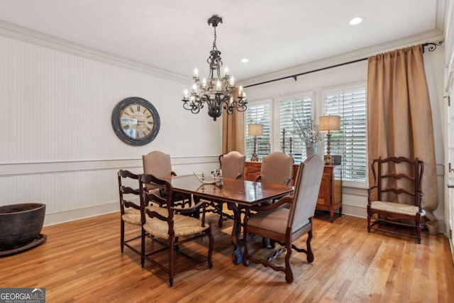 3903 Hazelhurst Dr, Marietta, GA 30066 - dining space featuring crown molding, light wood-type flooring, a chandelier, a wainscoted wall, and recessed lighting