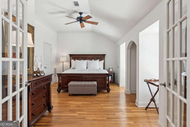3903 Hazelhurst Dr, Marietta, GA 30066 - bedroom with arched walkways, light wood-type flooring, french doors, baseboards, and lofted ceiling