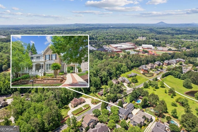 3903 Hazelhurst Dr, Marietta, GA 30066 - aerial perspective of suburban area featuring property parcel outlined and a heavily wooded area