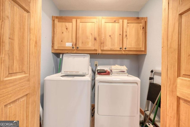 602 Mill Ridge Rd, Hiawassee, GA 30546 - laundry area featuring cabinet space and washing machine and dryer