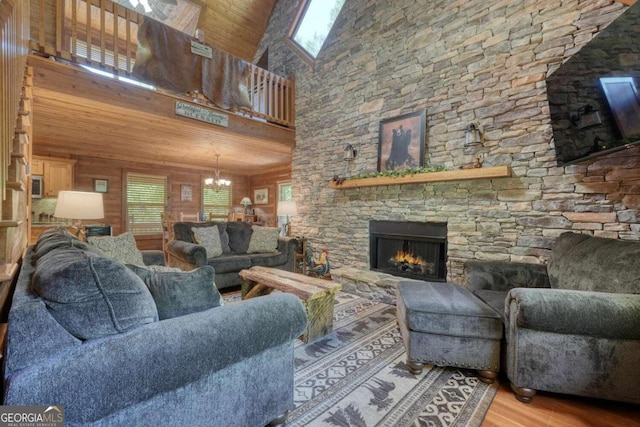 602 Mill Ridge Rd, Hiawassee, GA 30546 - living area featuring wood finished floors, a chandelier, a fireplace, a high ceiling, and wood ceiling