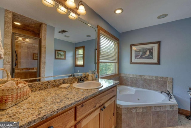 602 Mill Ridge Rd, Hiawassee, GA 30546 - full bath featuring vanity, a jetted tub, a stall shower, and recessed lighting
