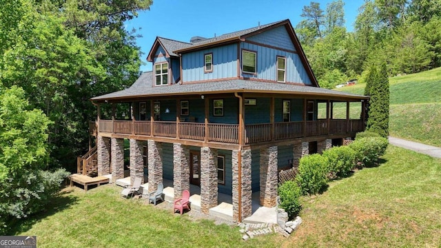 602 Mill Ridge Rd, Hiawassee, GA 30546 - rear view of house with a yard, board and batten siding, a patio, and a wooden deck