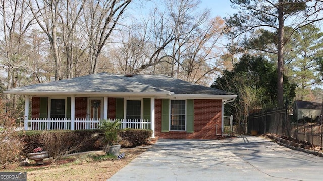 114 Sycamore Rd SW, Milledgeville, GA 31061 - single story home featuring a porch, brick siding, and driveway
