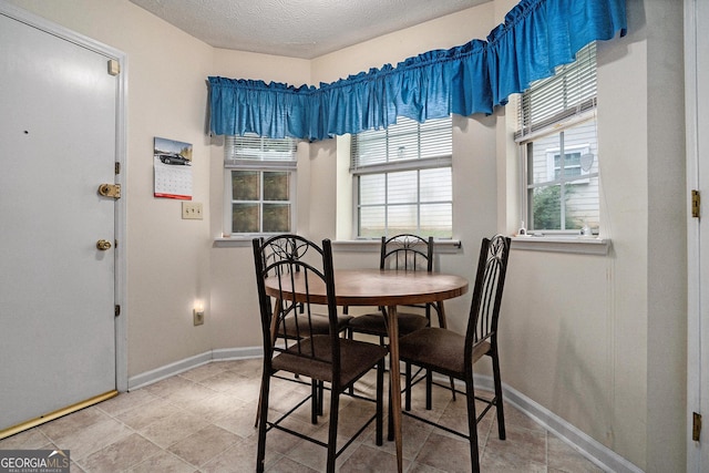 7847 Dogwood Way, Douglasville, GA 30134 - dining room featuring baseboards and a textured ceiling