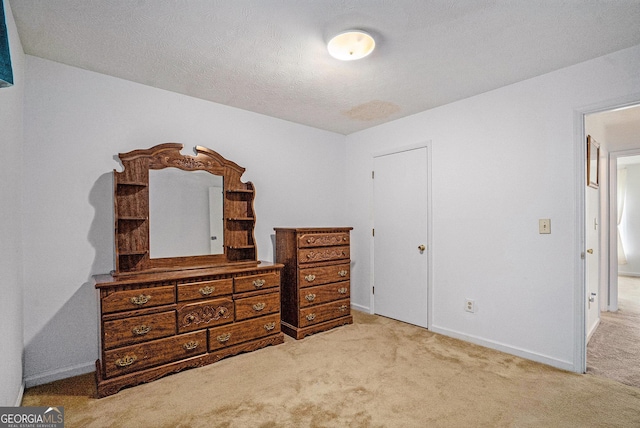 7847 Dogwood Way, Douglasville, GA 30134 - carpeted bedroom with baseboards and a textured ceiling
