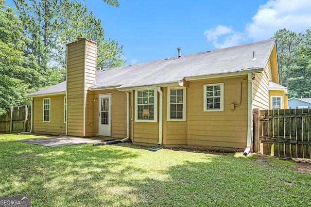 7847 Dogwood Way, Douglasville, GA 30134 - rear view of property with a chimney and a patio