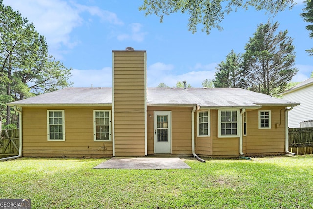 7847 Dogwood Way, Douglasville, GA 30134 - rear view of house featuring a chimney and a patio
