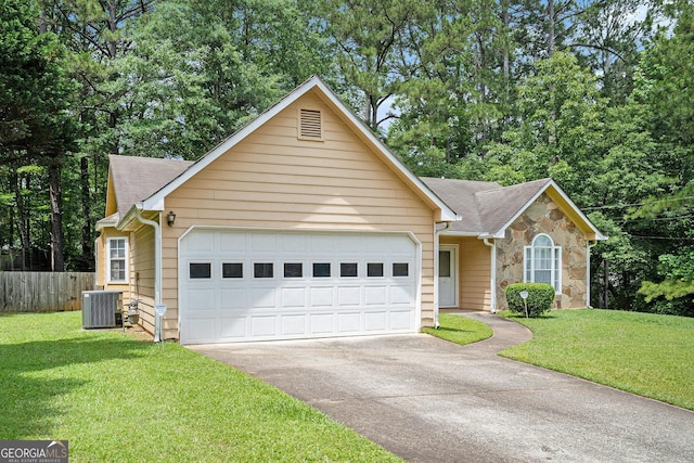 7847 Dogwood Way, Douglasville, GA 30134 - ranch-style home featuring an attached garage, central air condition unit, stone siding, and driveway