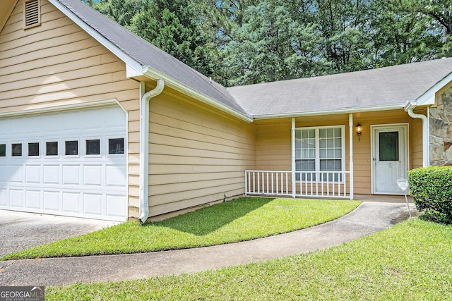 7847 Dogwood Way, Douglasville, GA 30134 - view of front of home featuring a shingled roof, an attached garage, covered porch, and a front lawn