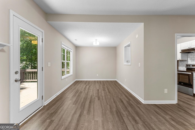 80 Corn Row Ct, Newnan, GA 30263 - unfurnished dining area with wood finished floors and baseboards