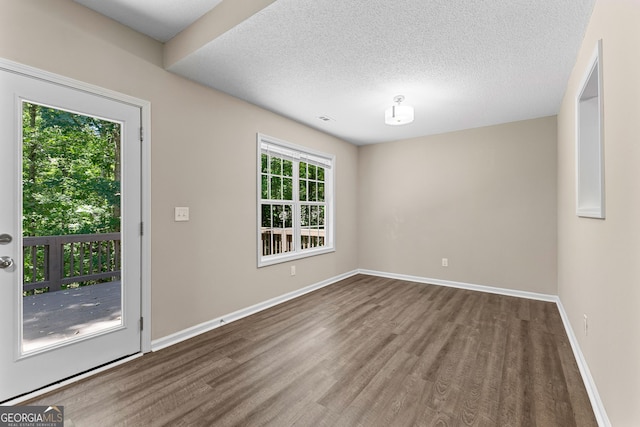80 Corn Row Ct, Newnan, GA 30263 - unfurnished room featuring wood finished floors, baseboards, and a textured ceiling