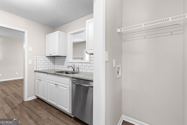 80 Corn Row Ct, Newnan, GA 30263 - kitchen featuring dishwasher, a sink, white cabinetry, light stone countertops, and dark wood-style floors