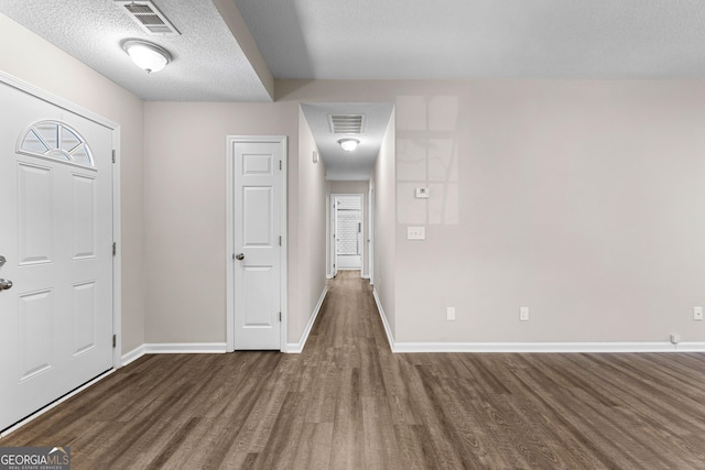 80 Corn Row Ct, Newnan, GA 30263 - foyer entrance featuring wood finished floors, baseboards, and a textured ceiling
