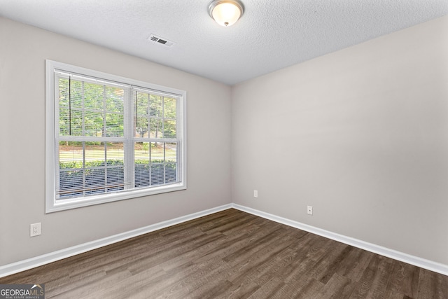 80 Corn Row Ct, Newnan, GA 30263 - unfurnished room with dark wood-type flooring, baseboards, and a textured ceiling