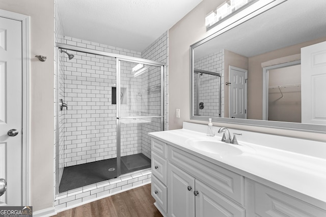 80 Corn Row Ct, Newnan, GA 30263 - full bath featuring a stall shower, vanity, wood finished floors, and a spacious closet