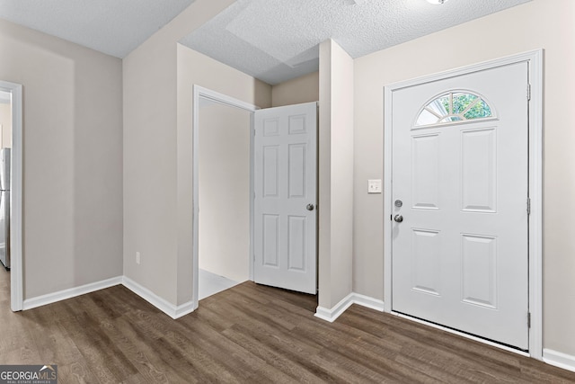 80 Corn Row Ct, Newnan, GA 30263 - foyer entrance featuring wood finished floors, baseboards, and a textured ceiling