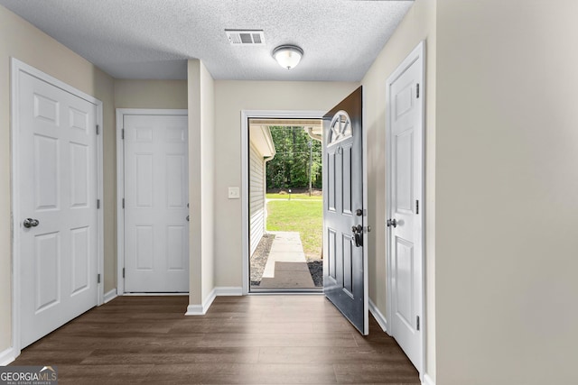 80 Corn Row Ct, Newnan, GA 30263 - foyer with dark wood-style flooring, baseboards, and a textured ceiling