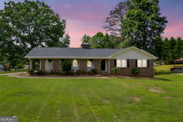 3642 S Bogan Rd, Buford, GA 30519 - ranch-style home featuring brick siding, a front lawn, and a chimney
