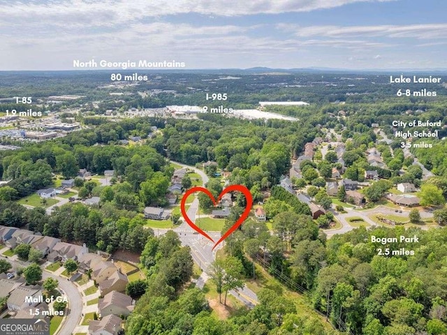 3642 S Bogan Rd, Buford, GA 30519 - aerial overview of property's location featuring a heavily wooded area
