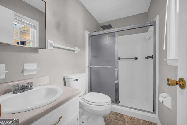 3642 S Bogan Rd, Buford, GA 30519 - bathroom featuring a stall shower, vanity, and toilet