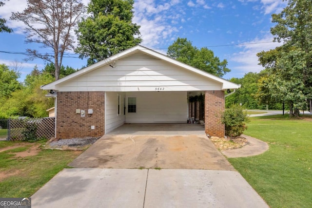 3642 S Bogan Rd, Buford, GA 30519 - view of front of home with brick siding, driveway, and a carport
