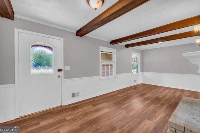 3642 S Bogan Rd, Buford, GA 30519 - foyer entrance featuring wood finished floors, beam ceiling, a wainscoted wall, and crown molding