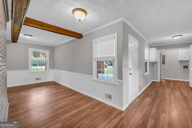 3642 S Bogan Rd, Buford, GA 30519 - entryway with wood finished floors, beamed ceiling, a textured ceiling, and baseboards