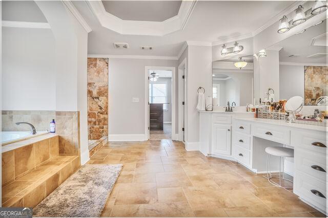 4818 Moon Hollow Ct, Buford, GA 30519 - full bath with vanity, a garden tub, and ornamental molding