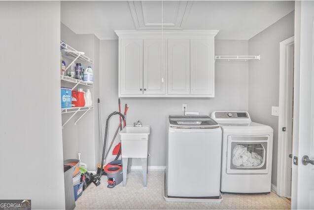 4818 Moon Hollow Ct, Buford, GA 30519 - laundry area featuring cabinet space, separate washer and dryer, carpet floors, and attic access