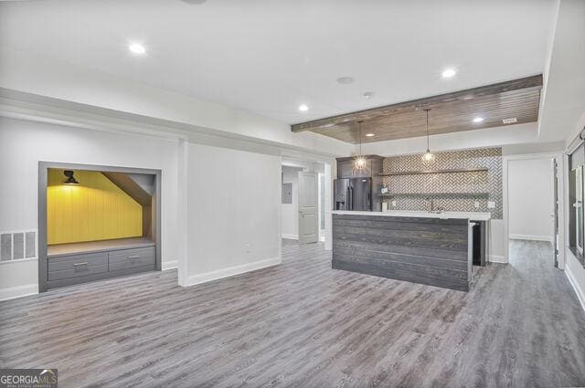 4818 Moon Hollow Ct, Buford, GA 30519 - kitchen with dark wood finished floors, baseboards, stainless steel fridge, and recessed lighting