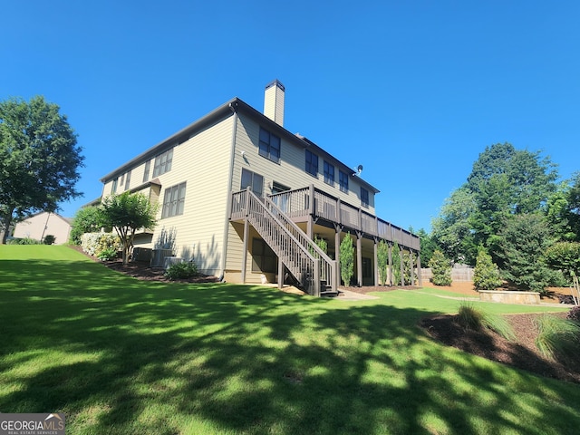 4818 Moon Hollow Ct, Buford, GA 30519 - rear view of property featuring stairs, a chimney, a lawn, and a wooden deck