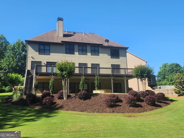 4818 Moon Hollow Ct, Buford, GA 30519 - rear view of property with a chimney, stairs, and a wooden deck