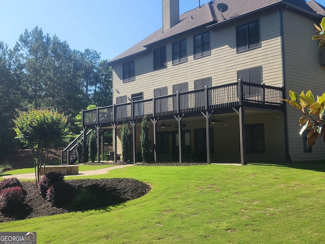 4818 Moon Hollow Ct, Buford, GA 30519 - rear view of property featuring ceiling fan, a lawn, a chimney, and a wooden deck