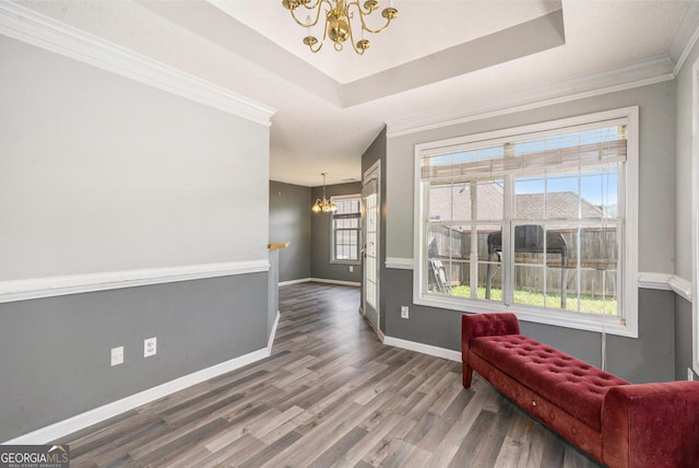 1478 Elena Dr, Mcdonough, GA 30253 - living area with a chandelier, wood finished floors, ornamental molding, and a raised ceiling