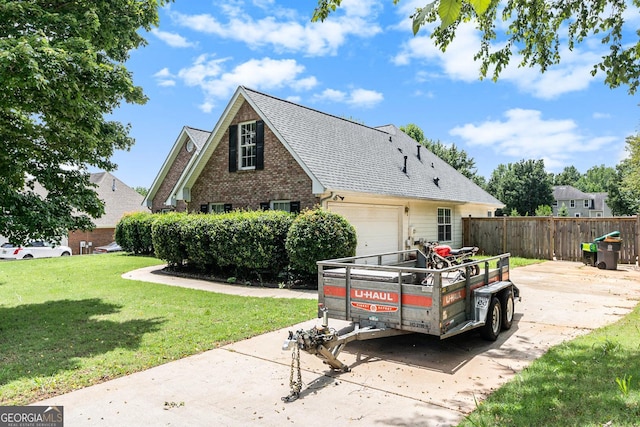1478 Elena Dr, Mcdonough, GA 30253 - view of side of home featuring driveway, a shingled roof, brick siding, and a garage