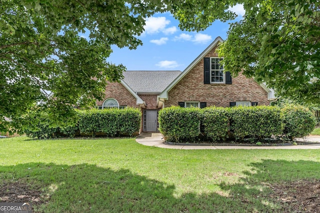 1478 Elena Dr, Mcdonough, GA 30253 - traditional-style house featuring a front yard, brick siding, and roof with shingles