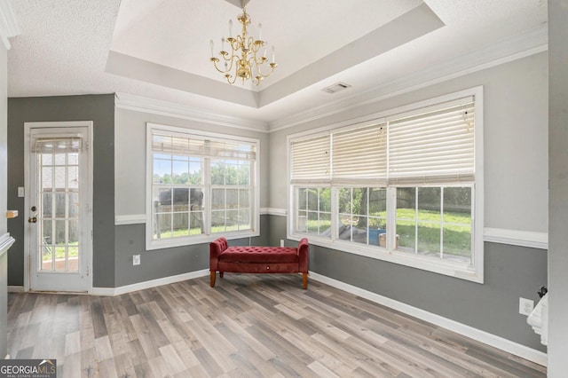 1478 Elena Dr, Mcdonough, GA 30253 - sitting room featuring a chandelier, crown molding, a tray ceiling, and wood finished floors