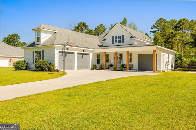 204 Dean Dr, Guyton, GA 31312 - view of front of home featuring a garage, a front lawn, concrete driveway, covered porch, and roof with shingles