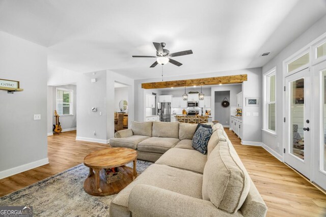 204 Dean Dr, Guyton, GA 31312 - living area featuring light wood-type flooring, ceiling fan, and baseboards