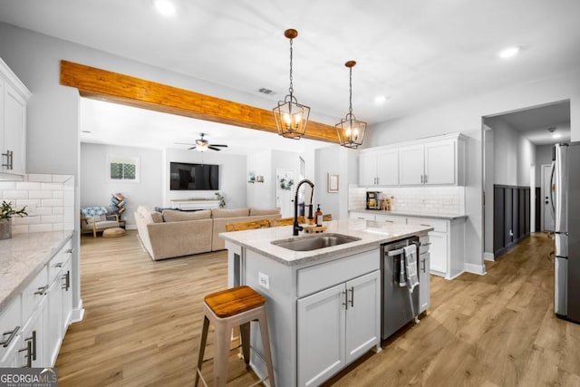 204 Dean Dr, Guyton, GA 31312 - kitchen featuring a sink, stainless steel appliances, decorative backsplash, recessed lighting, and light wood-style floors