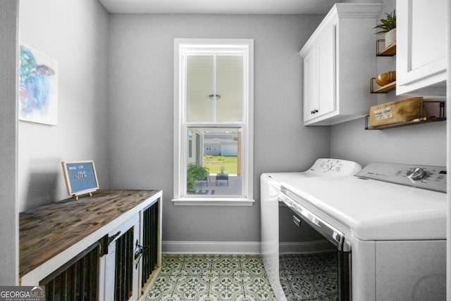 204 Dean Dr, Guyton, GA 31312 - laundry room featuring cabinet space, baseboards, and washer and clothes dryer