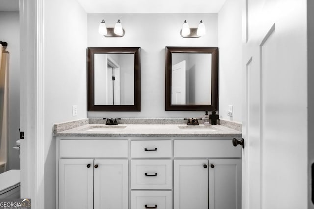 204 Dean Dr, Guyton, GA 31312 - bathroom featuring double vanity, toilet, and a shower