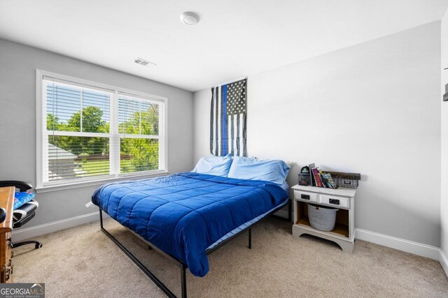 204 Dean Dr, Guyton, GA 31312 - carpeted bedroom featuring baseboards
