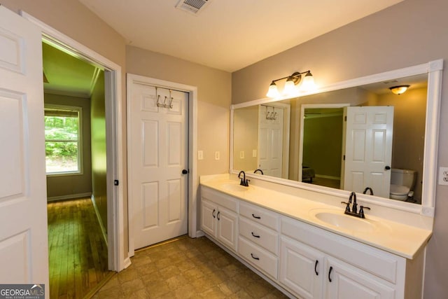 5533 Rose Ridge Ct, Flowery Branch, GA 30542 - full bathroom featuring double vanity and toilet