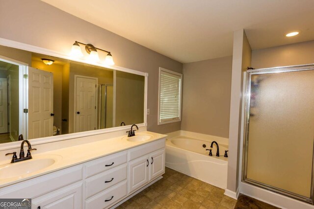 5533 Rose Ridge Ct, Flowery Branch, GA 30542 - full bath with a garden tub, double vanity, a stall shower, and recessed lighting