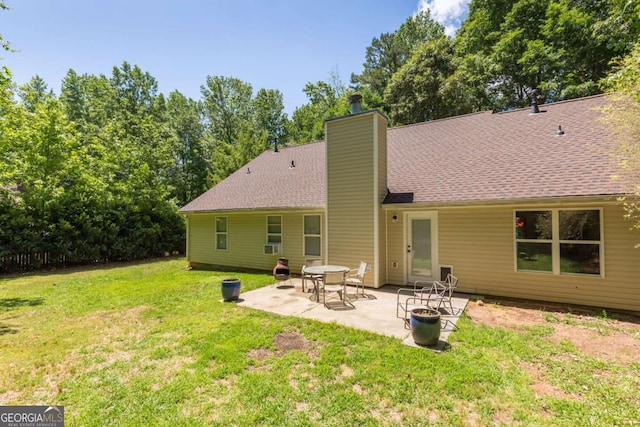 5533 Rose Ridge Ct, Flowery Branch, GA 30542 - back of property with a lawn, a patio, a chimney, and roof with shingles