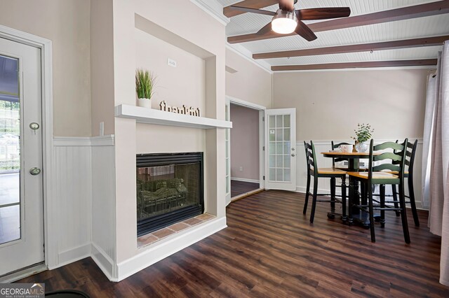 1223 Whitlock Ridge Dr SW, Marietta, GA 30064 - dining space featuring a ceiling fan, wood finished floors, a glass covered fireplace, and a wainscoted wall