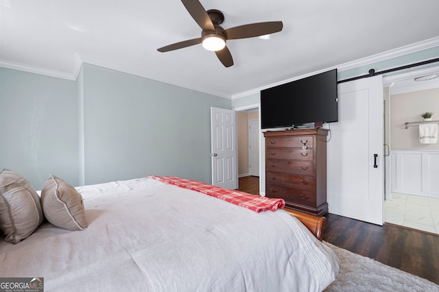 1223 Whitlock Ridge Dr SW, Marietta, GA 30064 - bedroom with dark wood-style floors, crown molding, a barn door, and a ceiling fan